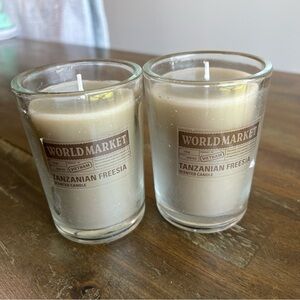 Cost Plus World Market gray Tanzanian Freesia scented candles. Set of 2 3in x 4